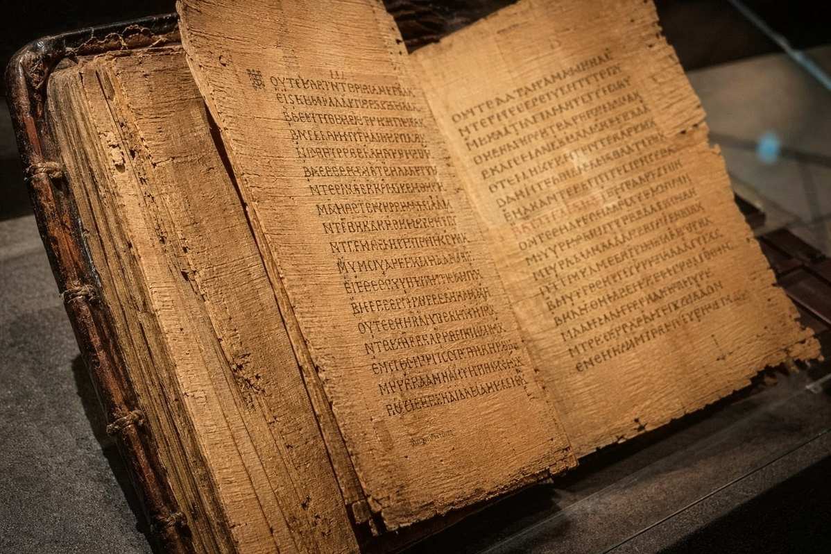 Ancient Coptic papyrus pages from Nag Hammadi Codex II showing multiple tractates