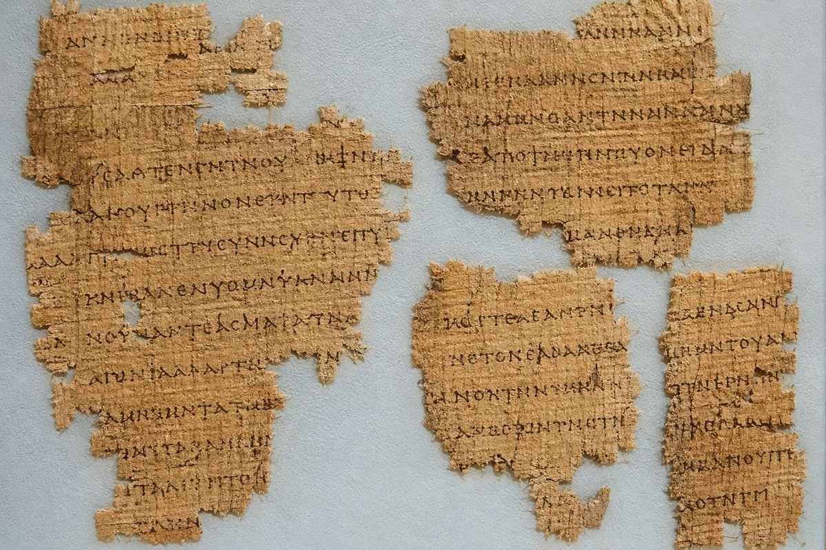 Fragmentary Coptic papyrus pages from Nag Hammadi Codex VII showing Subachmimic script