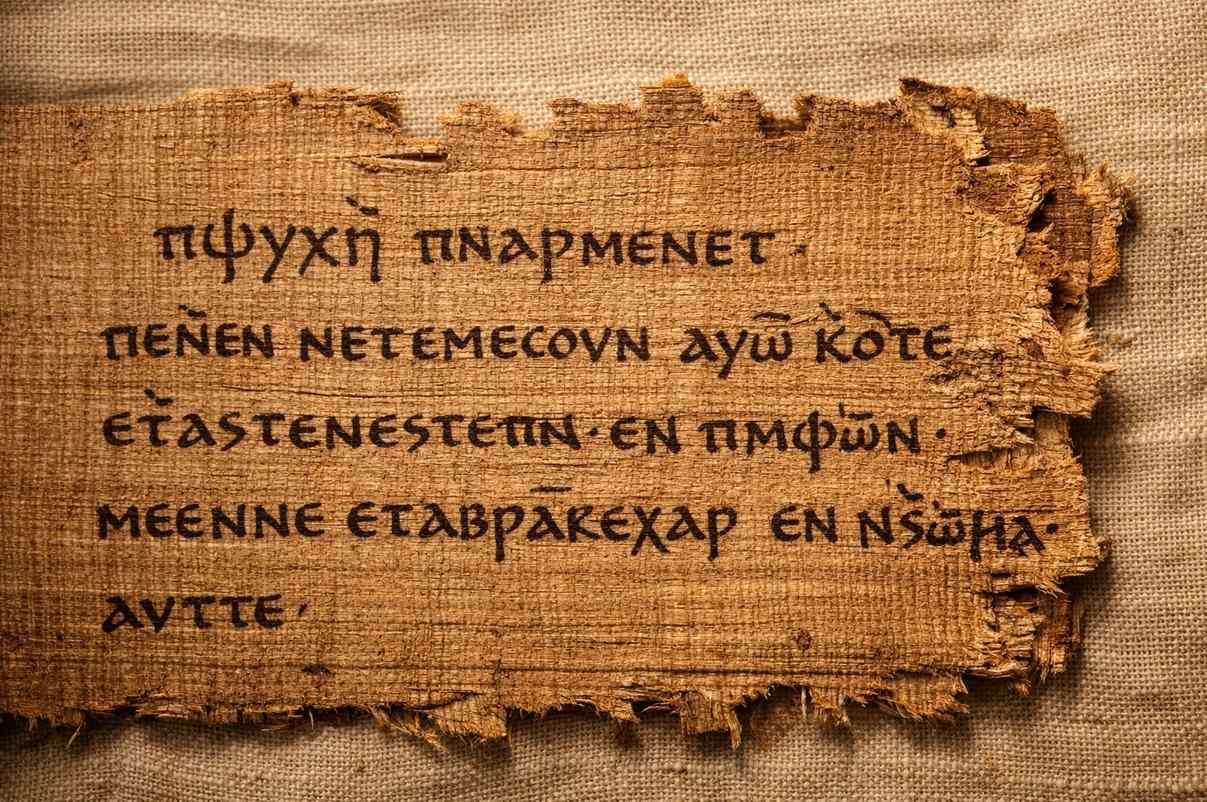 Ancient Coptic papyrus from Nag Hammadi Codex II showing the Exegesis on the Soul text with allegorical imagery